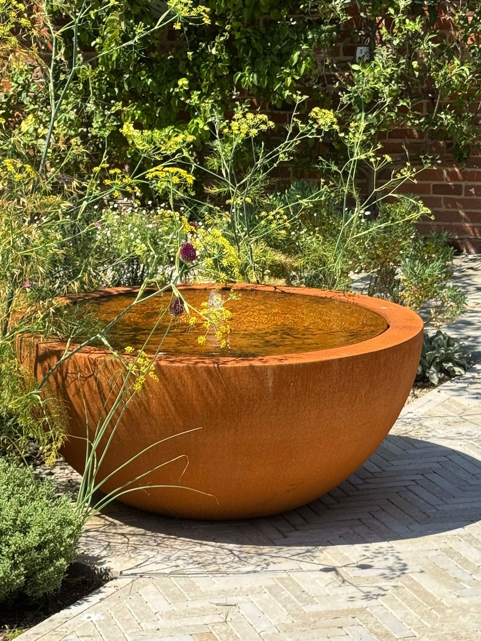 Corten steel round Bayou water table by Adezz