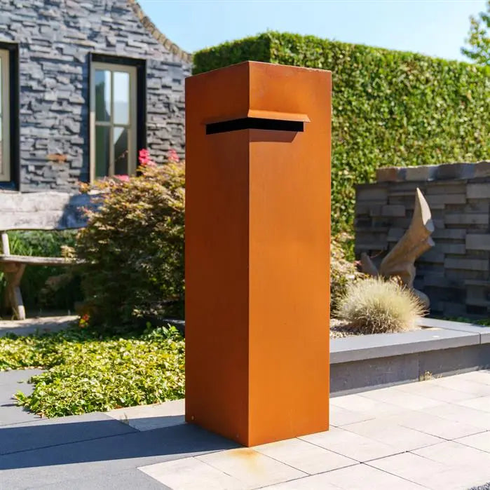 corten steel letterbxo with corner post slot next to house