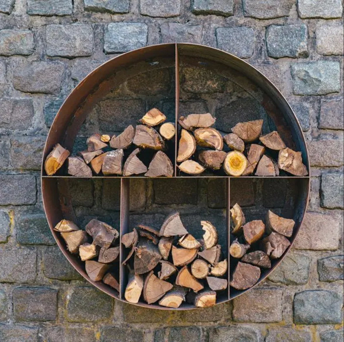 round wood store with chopped wood mounted on wall