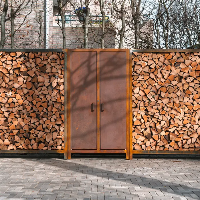 corten steel wood storage full of wood either side of a corten steel cupboard