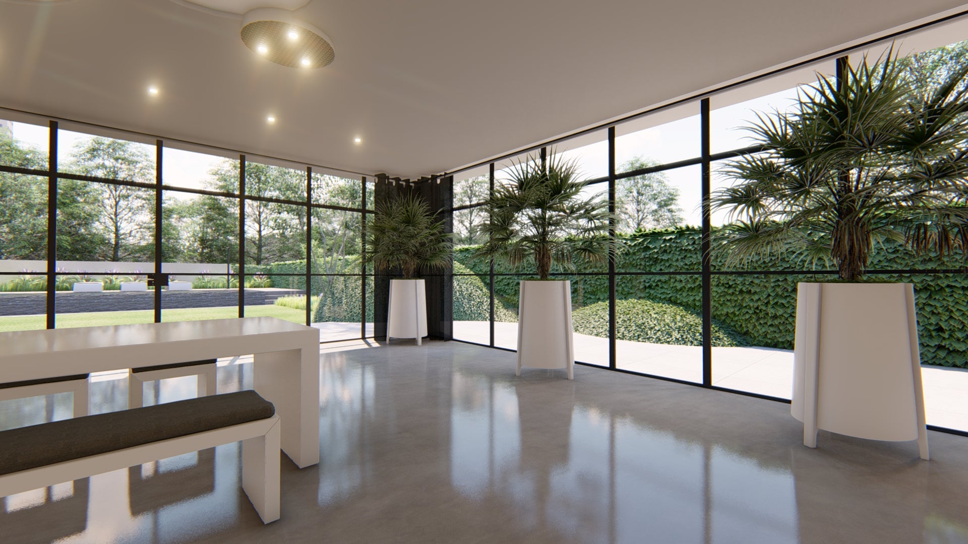 A modern interior space with large black-framed windows overlooking a landscaped green lawn, featuring a white table and bench in the foreground, tall potted palm trees, and a polished concrete floor.