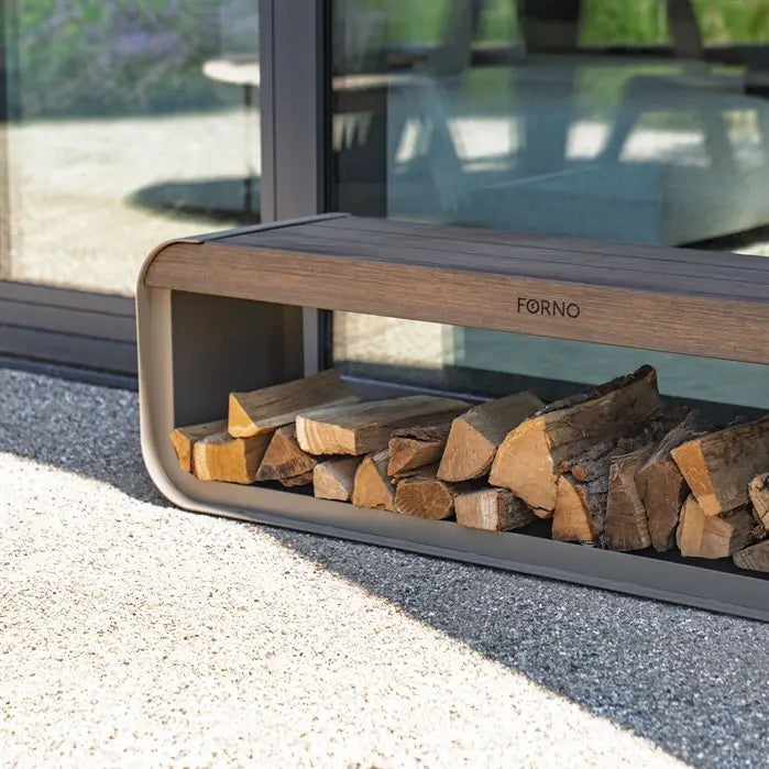 Wooden firewood holder with stacked logs on a patio, featuring the brand 'Forno'.