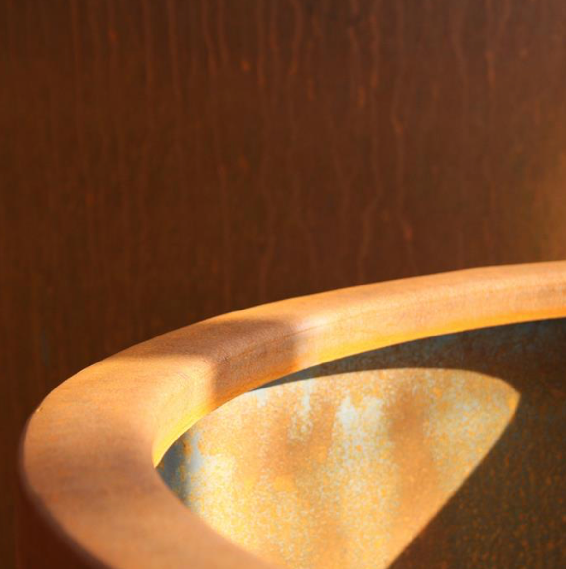 detail of a conic corten garden planter
