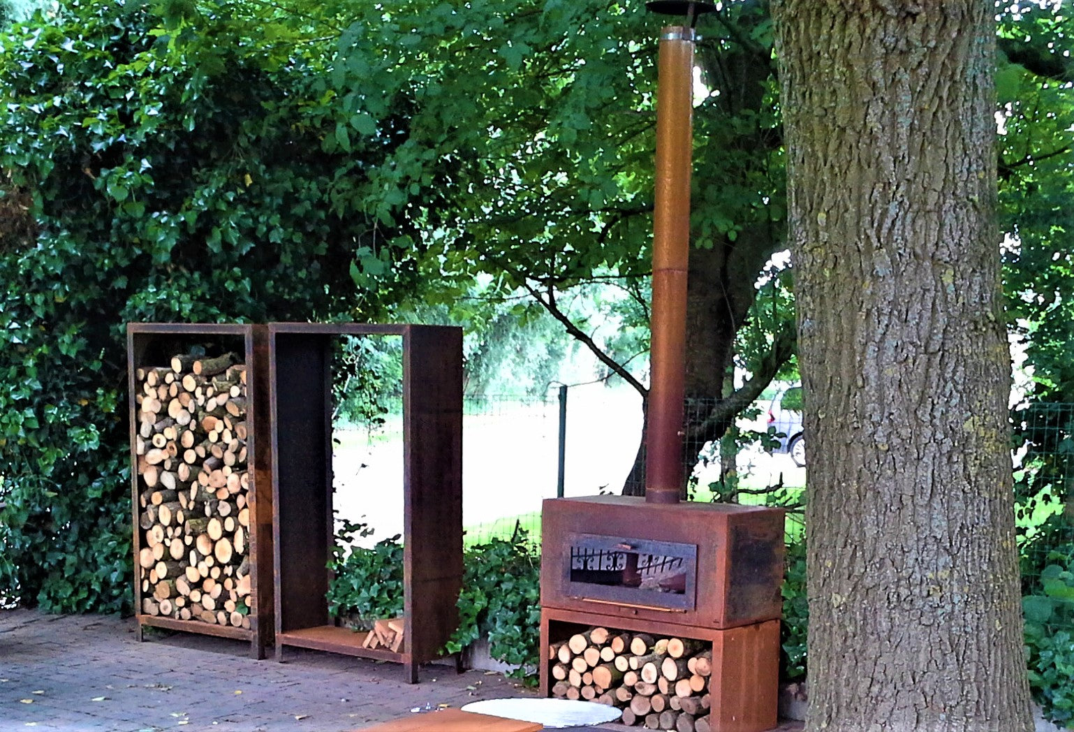 wood store underneath a corten steel stove