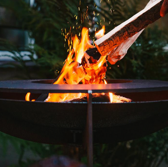 lit bbq fire table with flaming wood