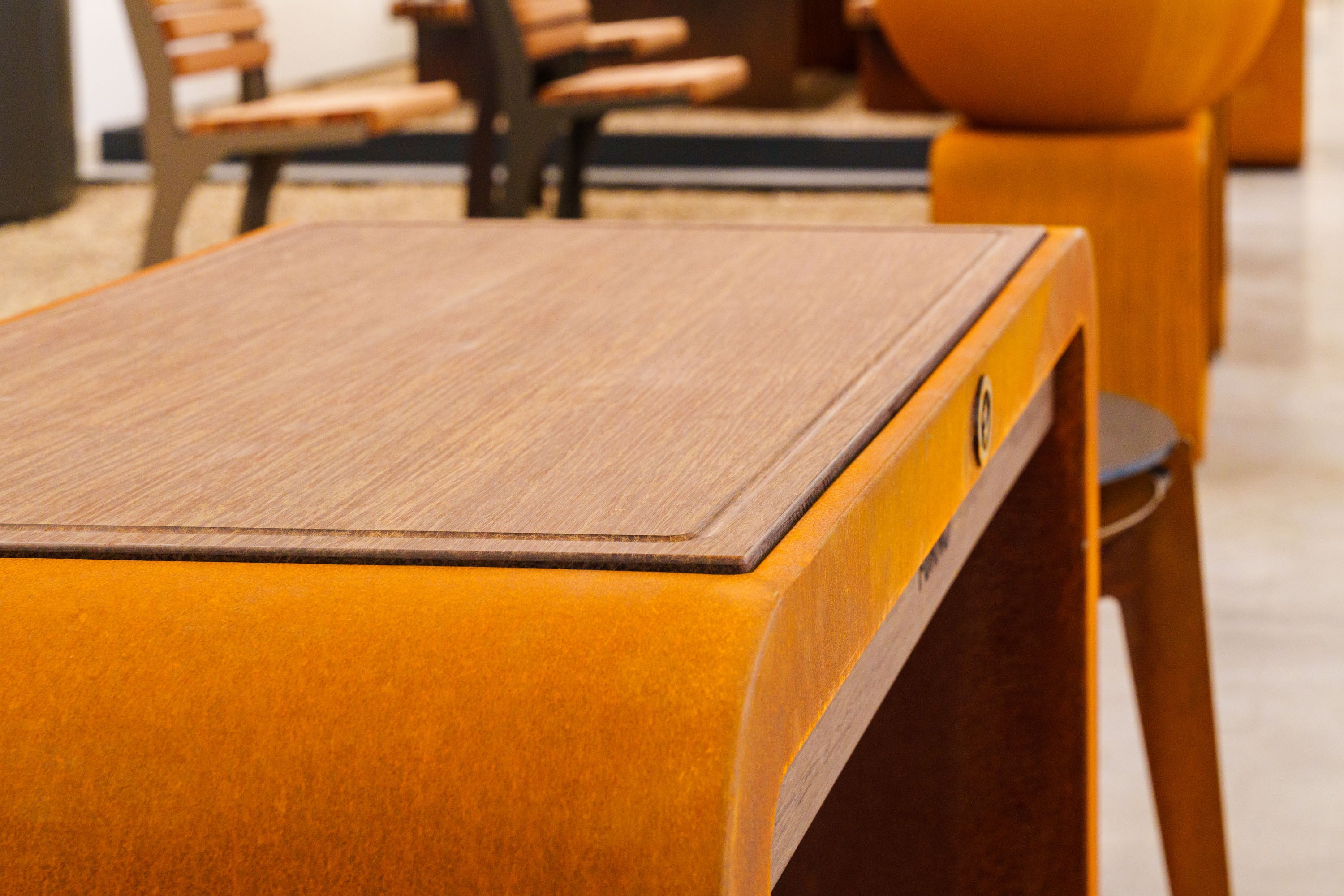 corten and bamboo workstation in indoor setting