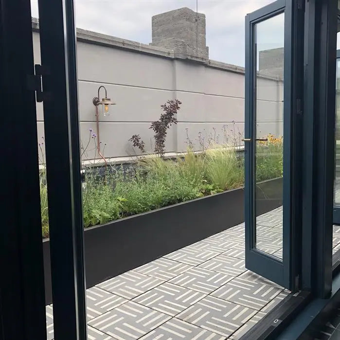 black aluminium retaining wall on roof top patio