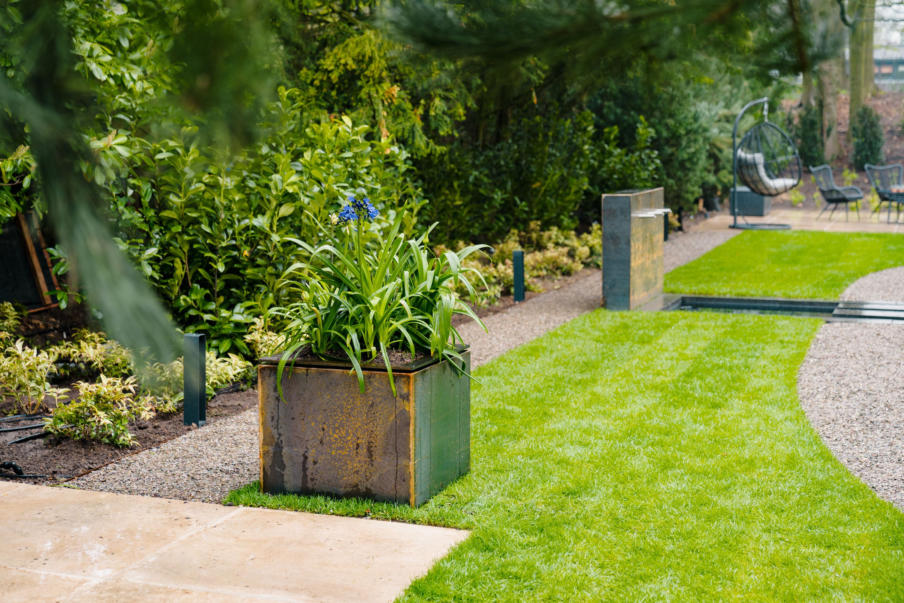 Garden scene with a planter box and greenery