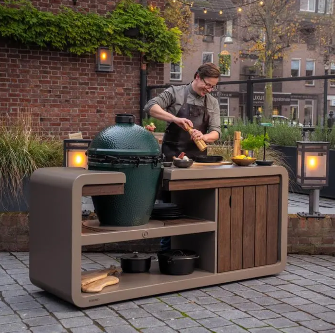 man preparing food on egg bbq work station