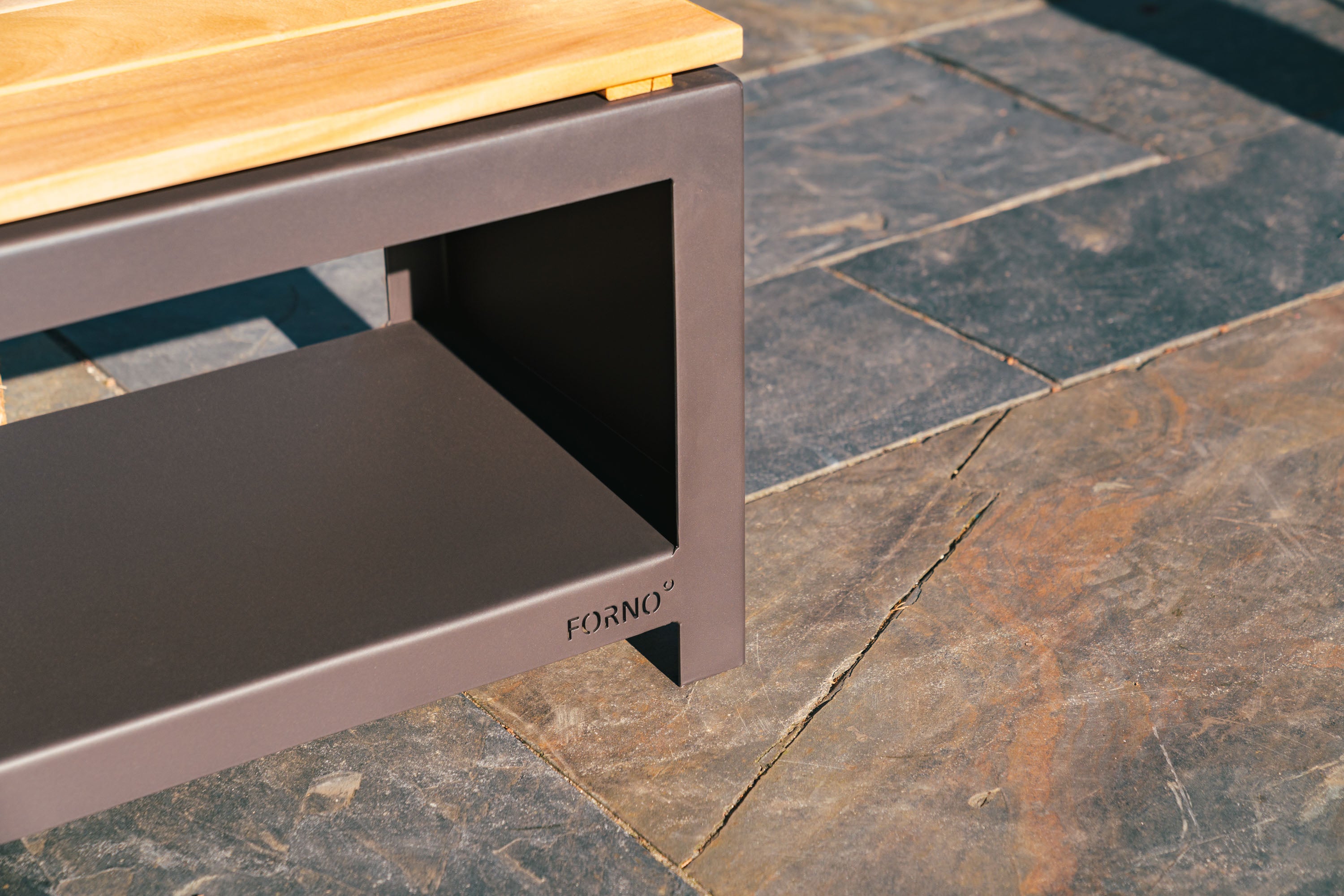 detail of empty black wood storage bench with wooden top