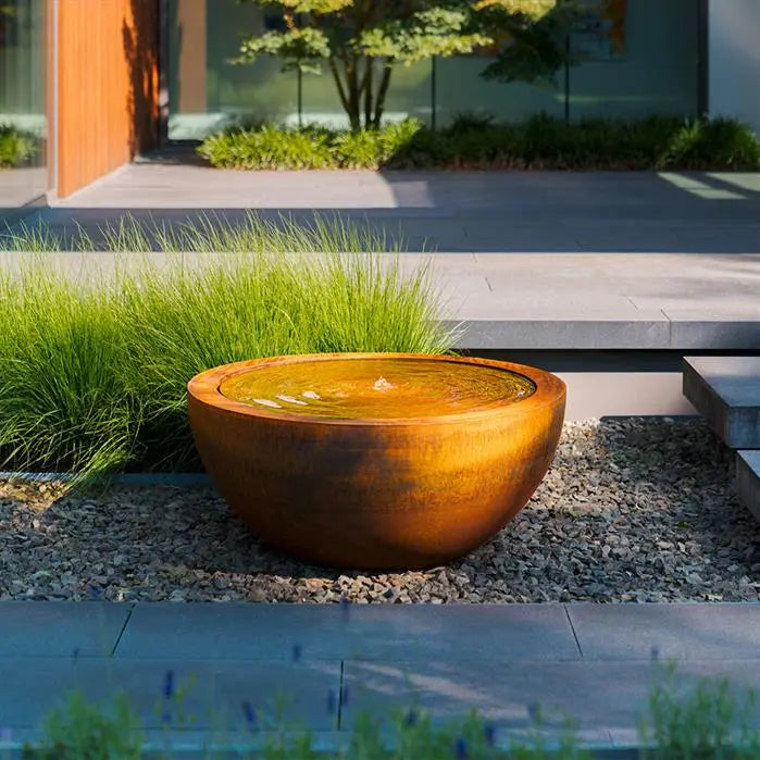 round corten pond filled with water