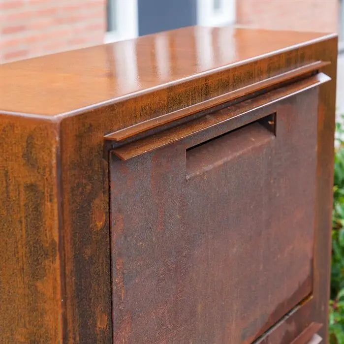 detail of corten letterbox posting slot