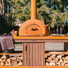 outdoor kitchen and pizza oven with wood storage