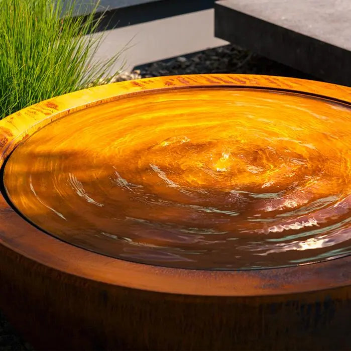 round corten pond filled with water