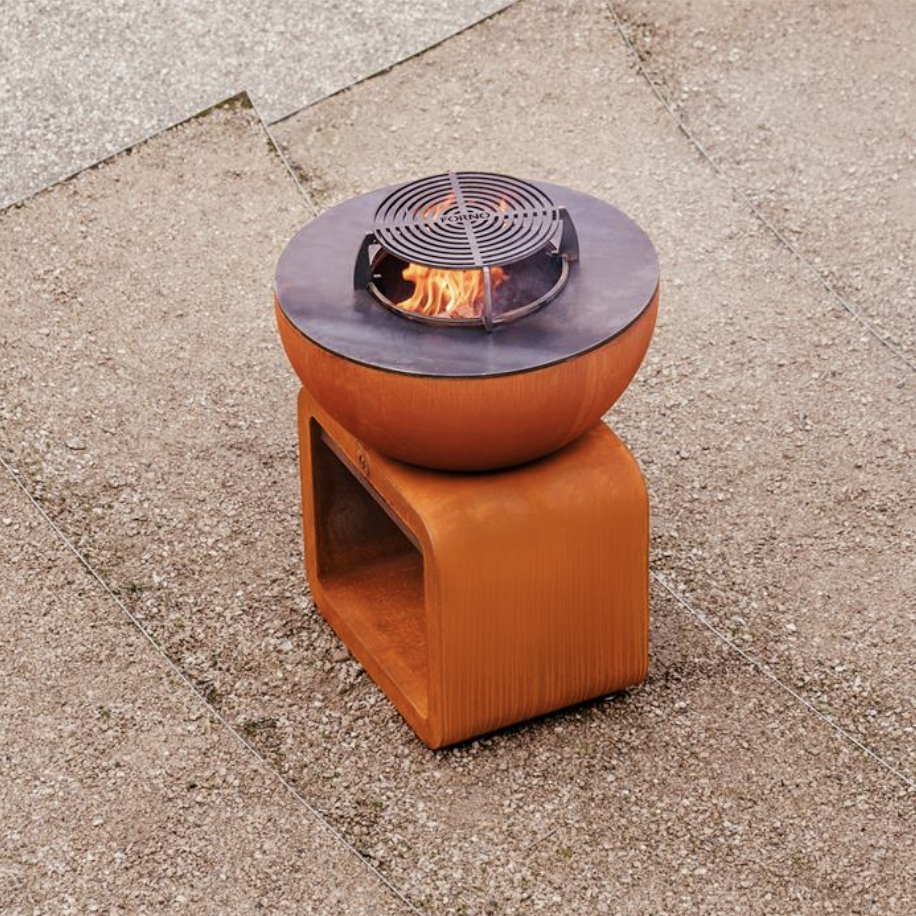 outdoor grill and bbq made from corten steel with wood storage