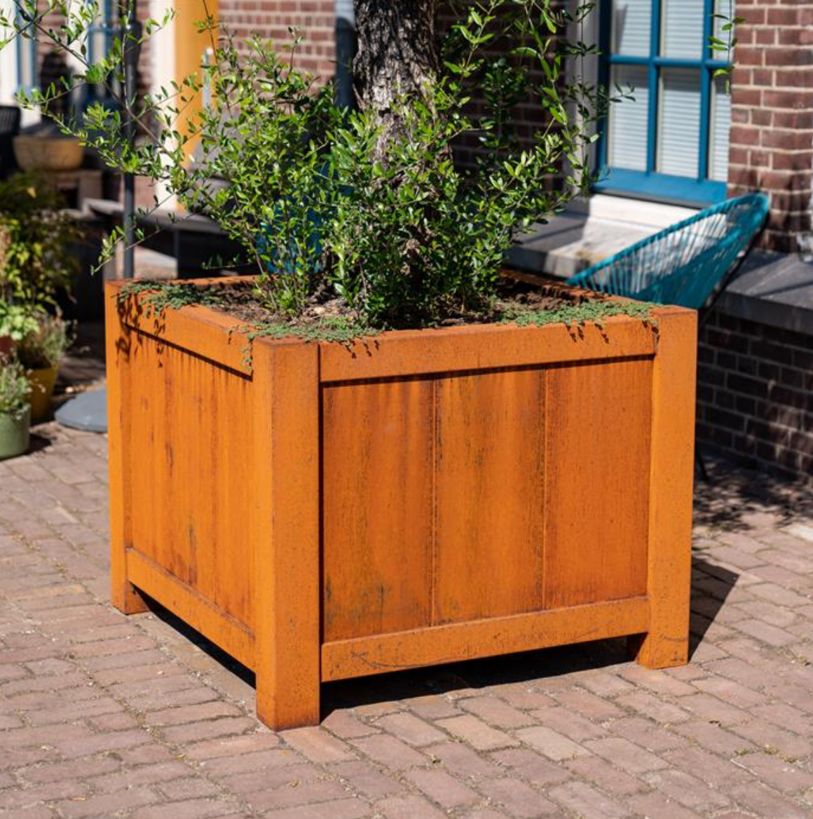 large square rusted planter with feet