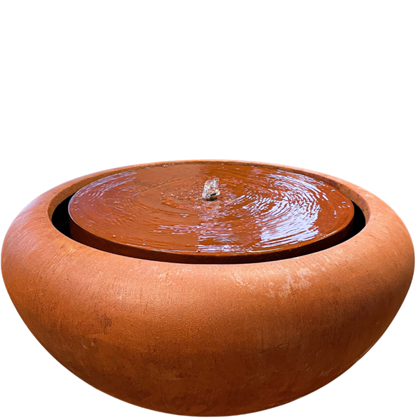 rust coloured squat round fibreglass water table with central fountain