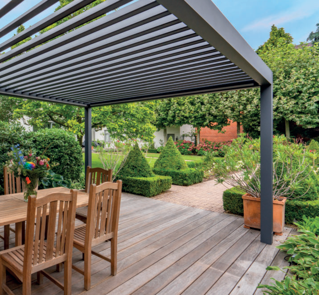 louvered roof pergola set on decking above table and chairs