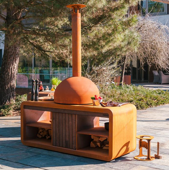 outdoor kitchen in corten steel with pizza oven and wood store