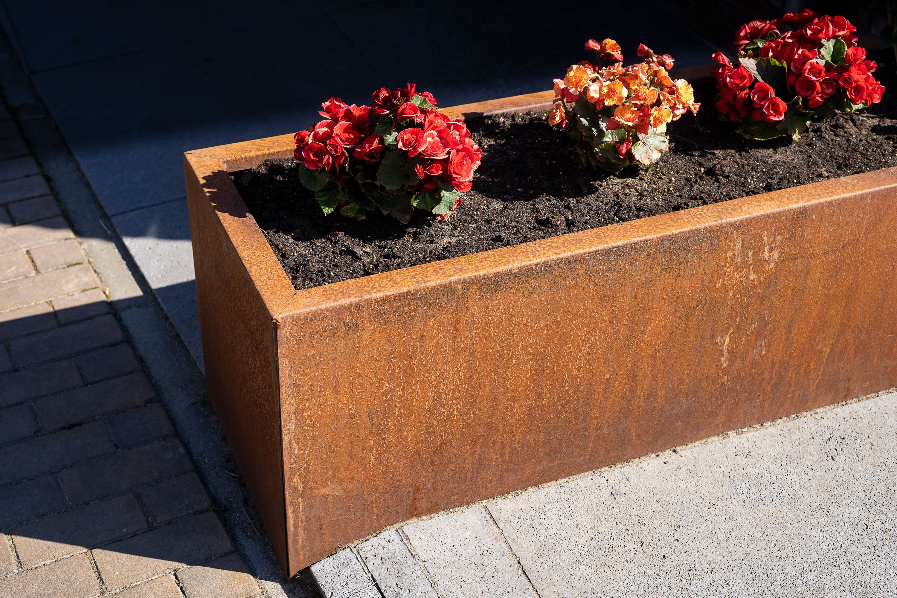 rust effect trough garden planter with plants