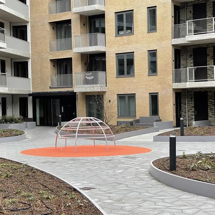 coated steel retaining walls surrounding flower bed in a public courtyard