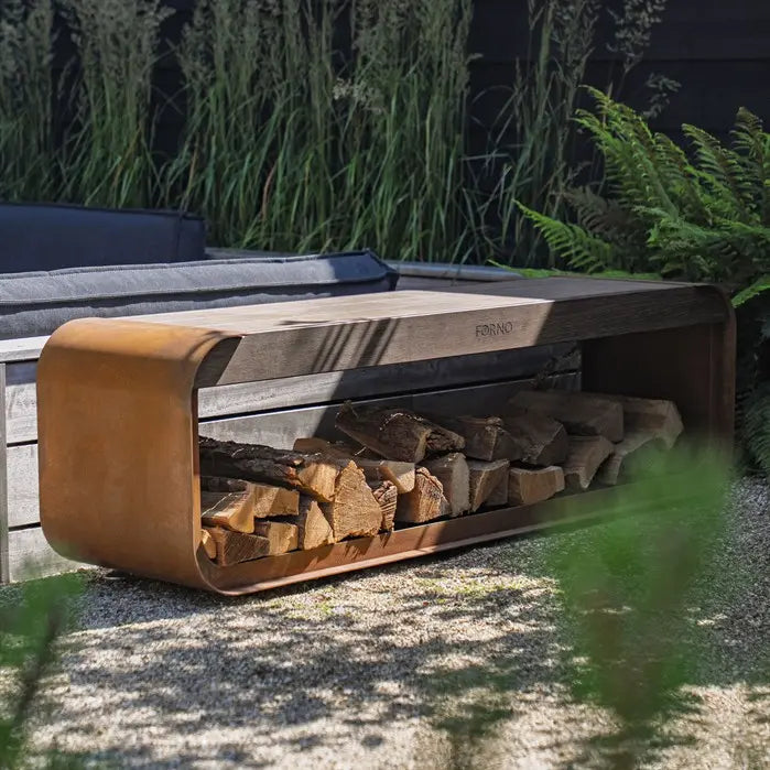 Wooden & corten firewood holder with stacked logs in a garden setting