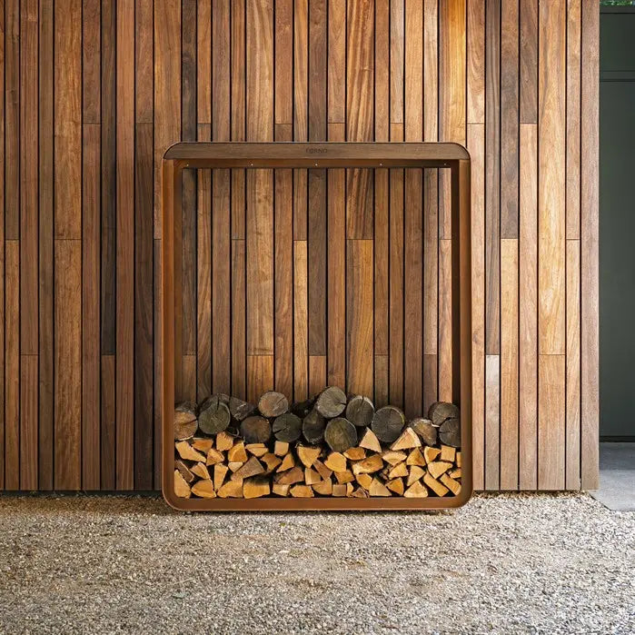 Wooden firewood holder against a wooden wall