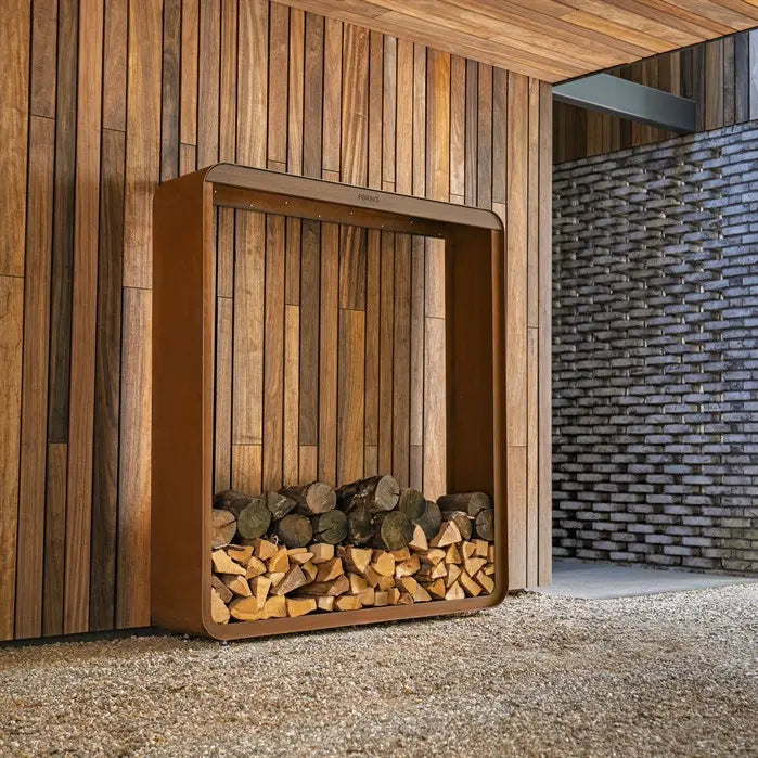 Wooden firewood holder against a wooden wall with a textured stone wall in the background