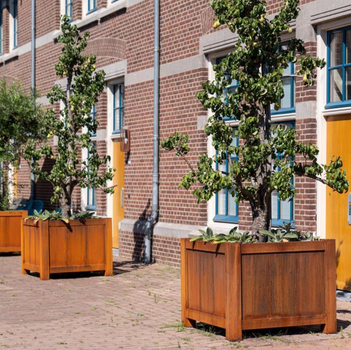 three square corten steel planters with feet