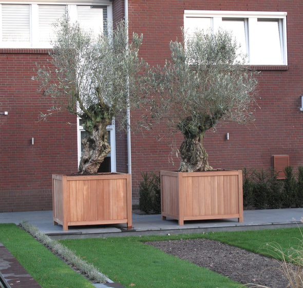 two wooden garden planters with feet next to each other