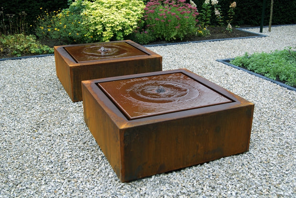2 square corten water tables filled with water