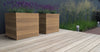 hardwood cube garden planters on decking planted with herbs