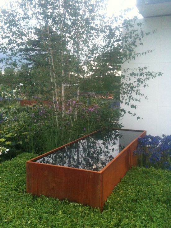 rectangular Corten pond filled with water