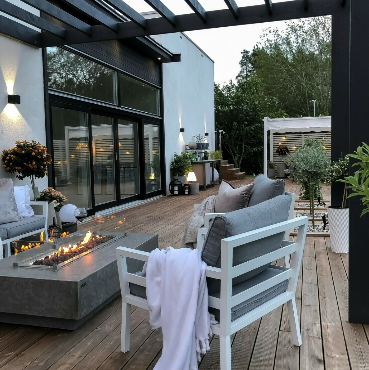 hampton gas fire table on decking under pergola