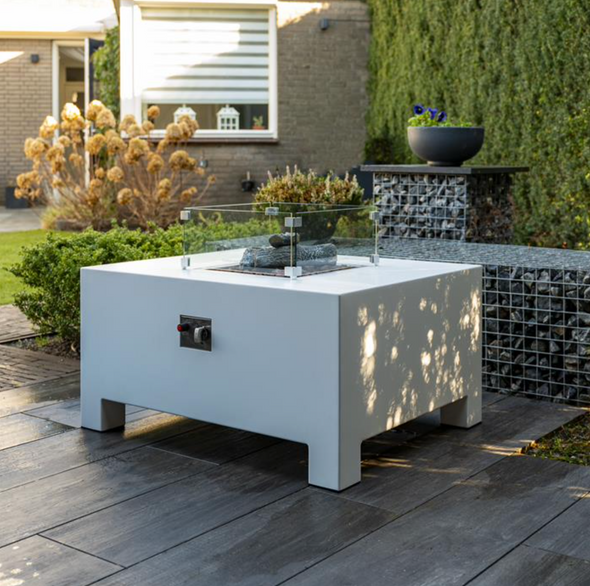 white gas fire table on wooden decking