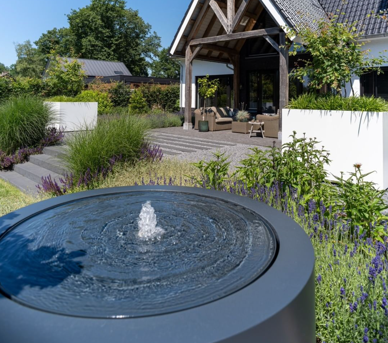 round black aluminium water table filled with water