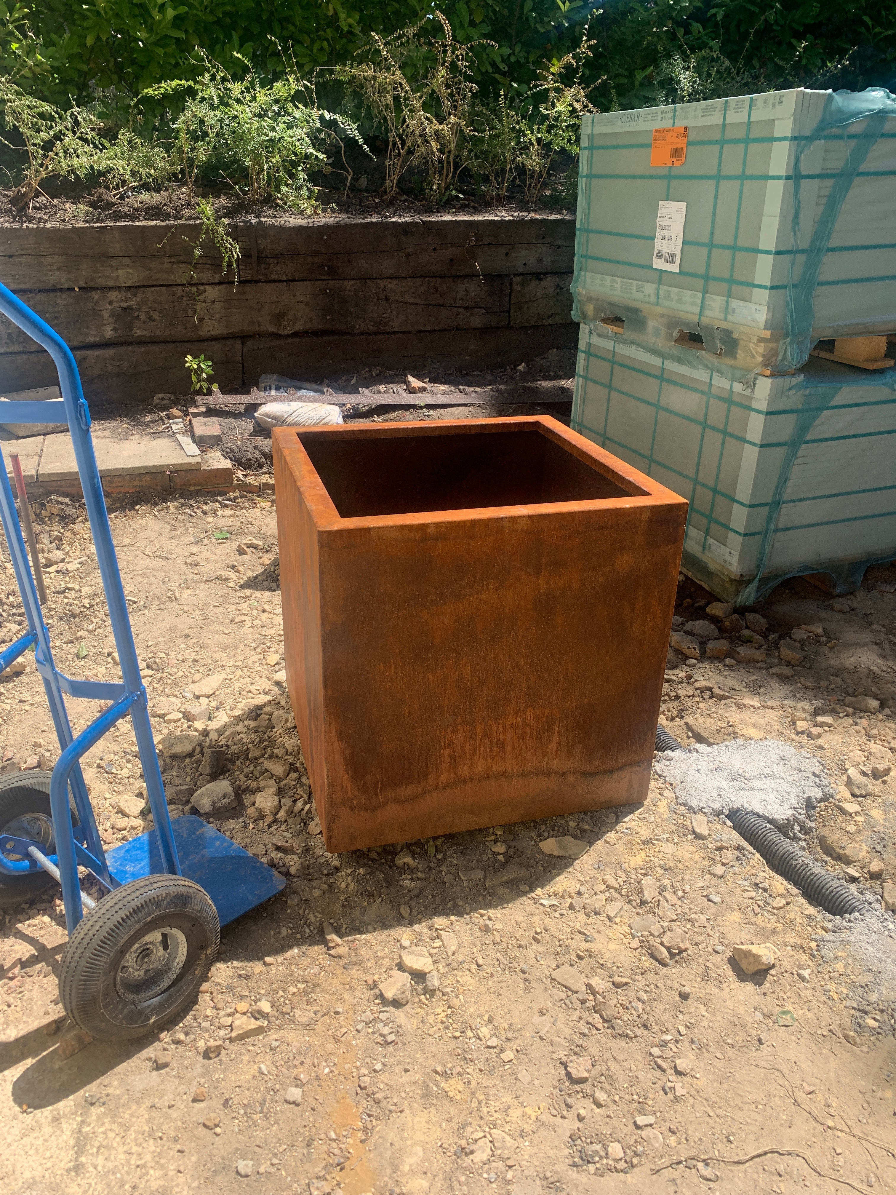 corten steel garden planter in building aera