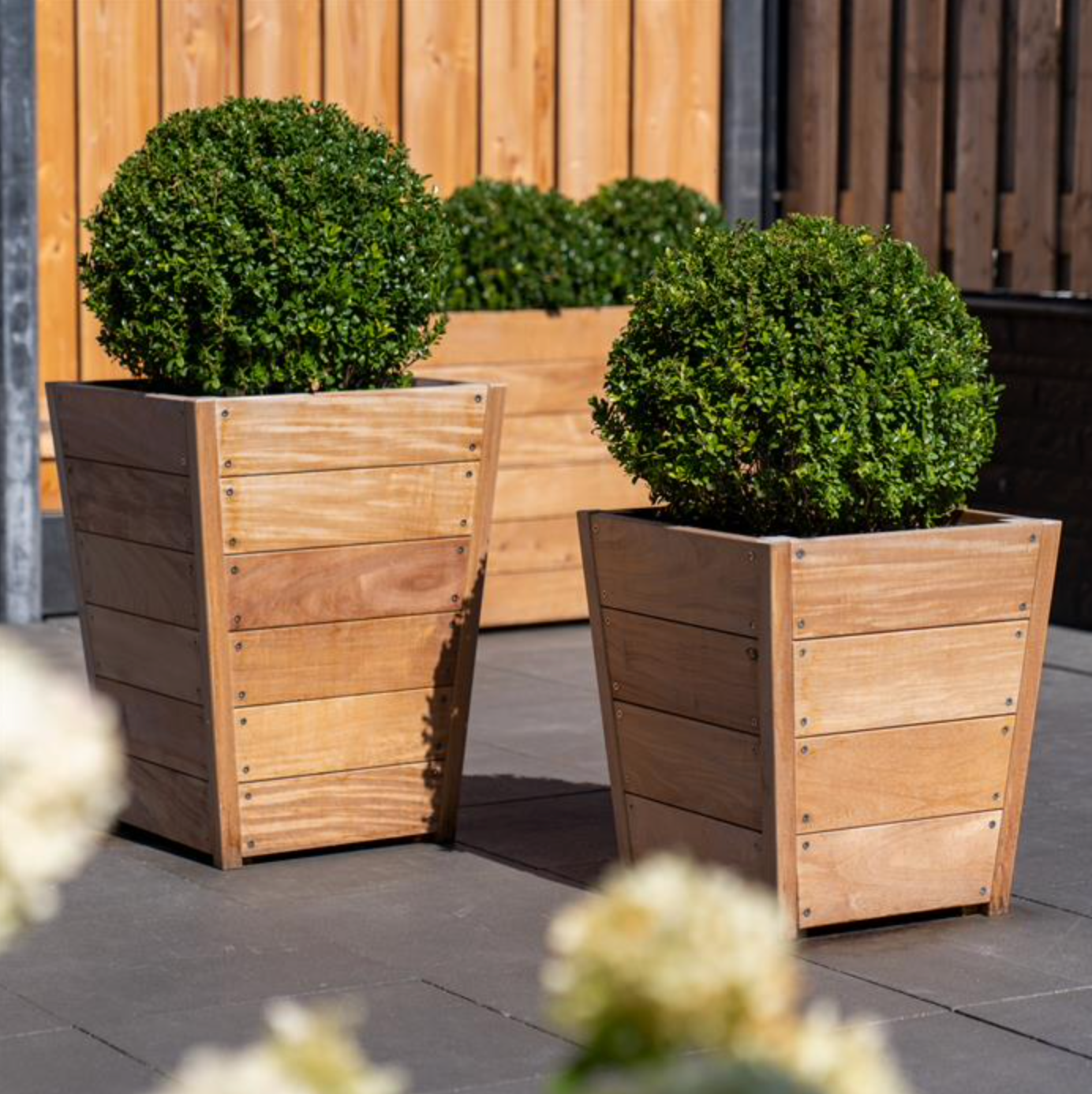 two tapered wooded garden planters