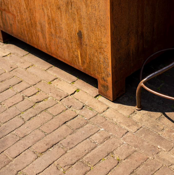 detail of square corten steel planter with feet