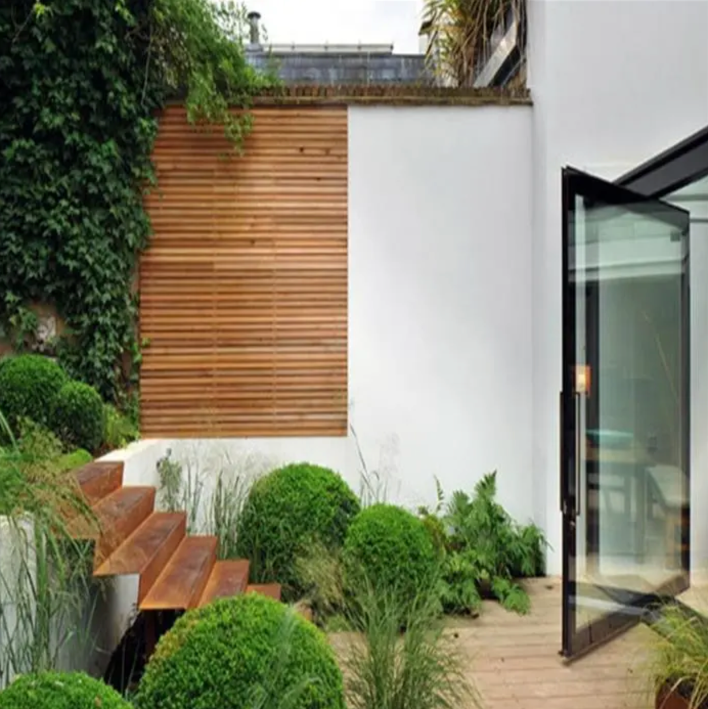 corten steel garden steps on small patio area