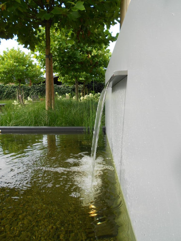 water fall feature on pond wall